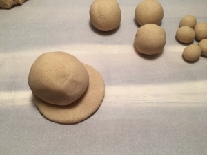 Put the large Ball as the body. Wet the dough a little, it acts as glue to hold it in place